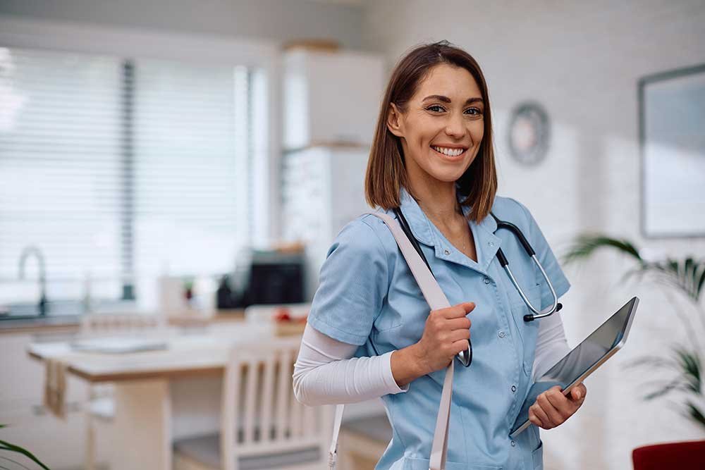 Healthcare professional holding a tablet